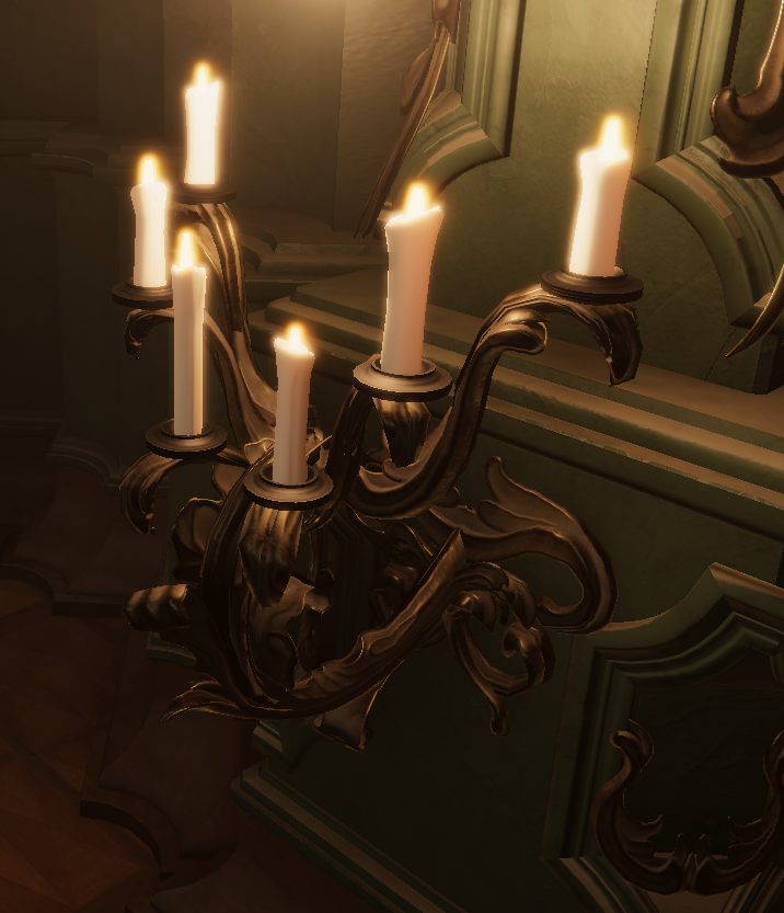 Candelabra sconce built from scrollwork cards