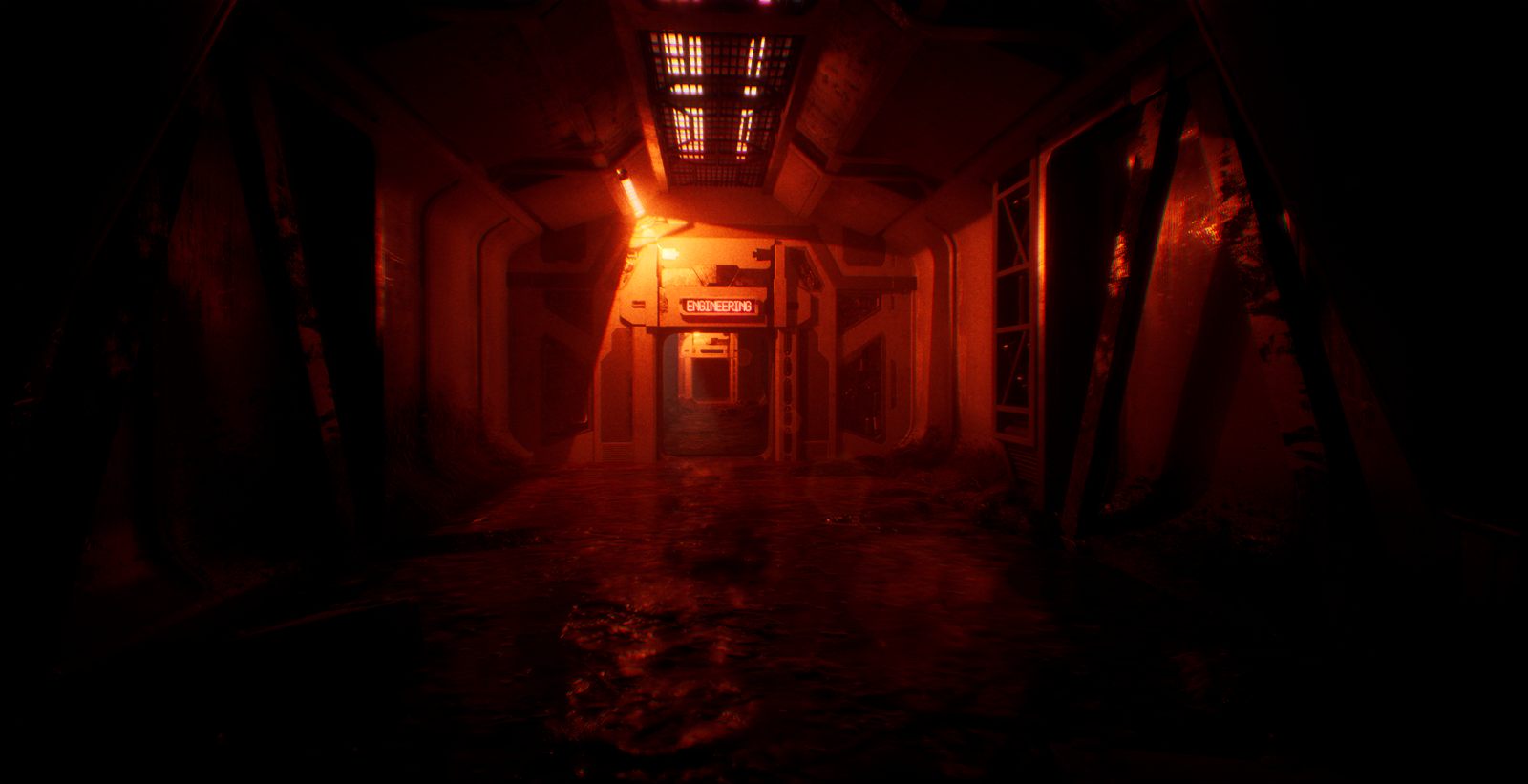 INFESTSTATION red emergency-lit corridor